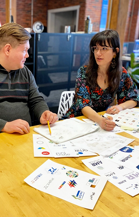 Designers reviewing logo concepts for branding services